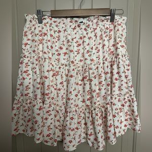 White with red floral tiered mini skirt. Size xl. Good condition- never worn.